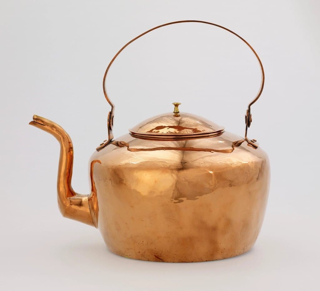 Hammered copper stovetop kettle with a high swing handle