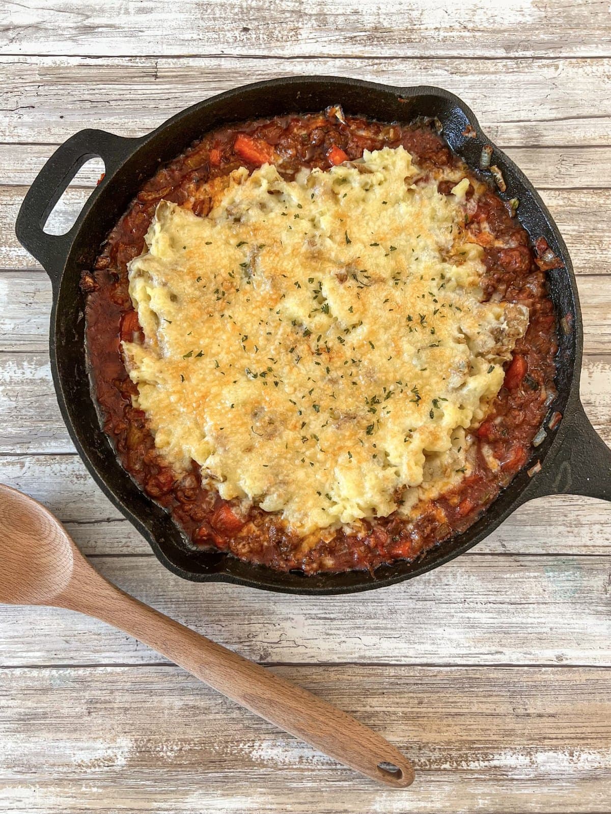 Pre-seasoned cast iron skillet on a dark kitchen surface