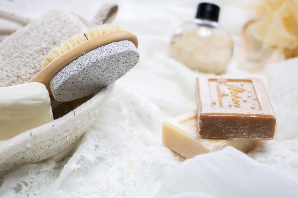Set of natural soap bars stacked on linen
